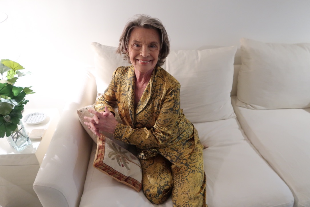 Diana d'Orville grandmother model wearing sustainable luxury loungewear - green and gold silk pigiama palazzos