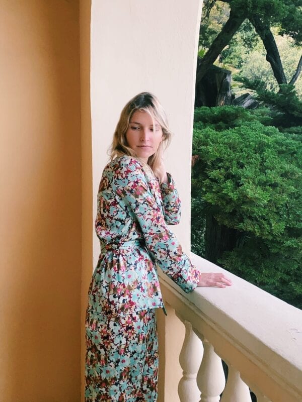 Lucillia Chenel wears Diana d'Orville sustainable luxury silk suit with liberty flower prints