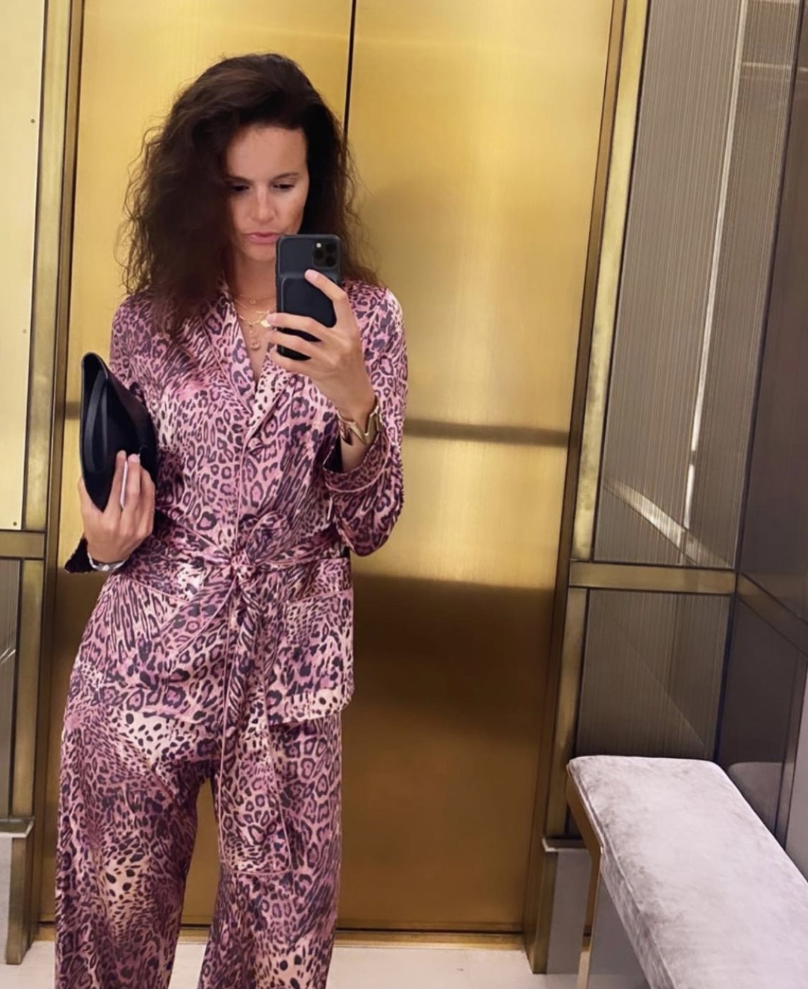 Charlotte Collard wears pink panther silk loungewear couture by Diana d'Orville