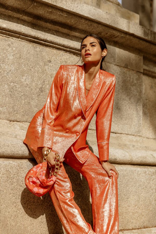 Clara Muniz in Diana d'Orville luxury pink peach gold suit