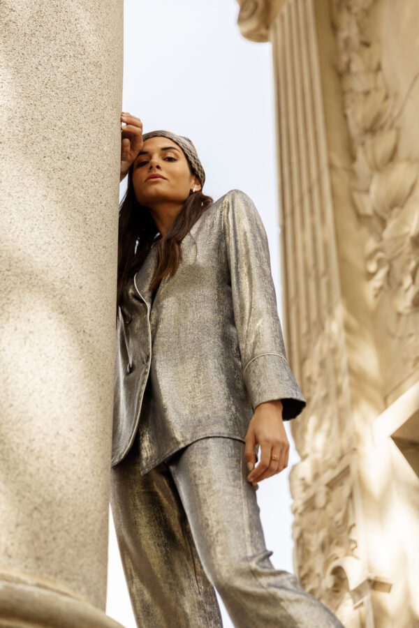 Clara Muniz in Diana d'Orville luxury lamé blue palazzo suit
