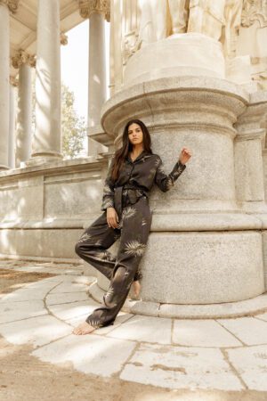 Clara Muniz in Diana d'Orville luxury silk dark palm printed suit